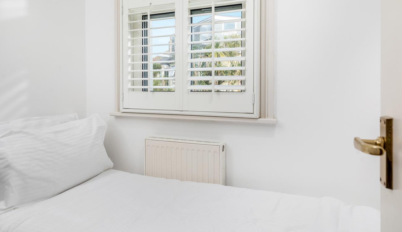 Bedroom 3 has a small single bed suitable for a little one.