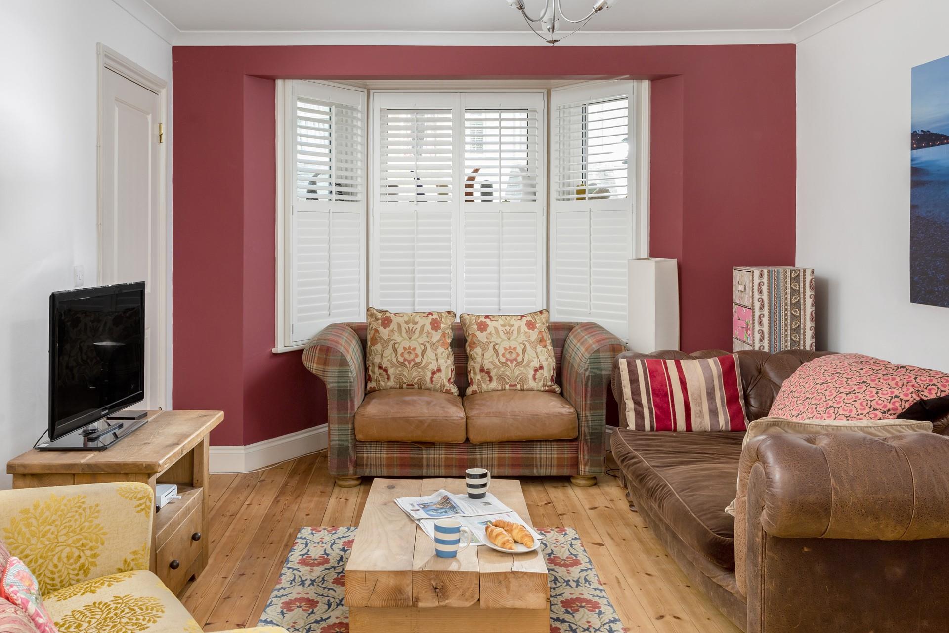 The colourful sitting room is the perfect base to come back to after a day on the beach.