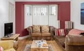 The colourful sitting room is the perfect base to come back to after a day on the beach. - Thumbnail Image
