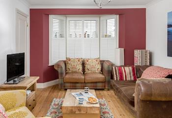 The colourful sitting room is the perfect base to come back to after a day on the beach.