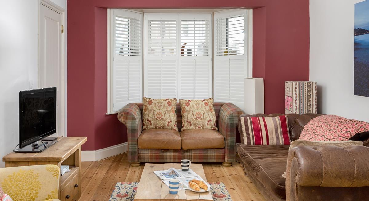 The colourful sitting room is the perfect base to come back to after a day on the beach.