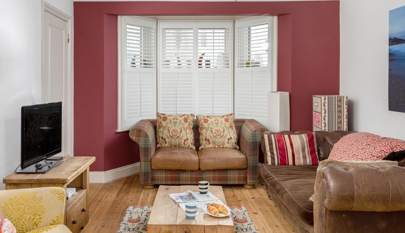 The colourful sitting room is the perfect base to come back to after a day on the beach.