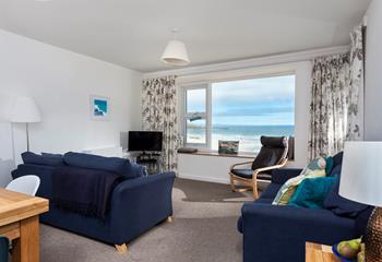 Sink into the sofa and spend hours gazing out at the waves rolling onto the beach.