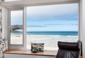 Sit in front of the window with a cup of tea watching the comings and goings on the beach.