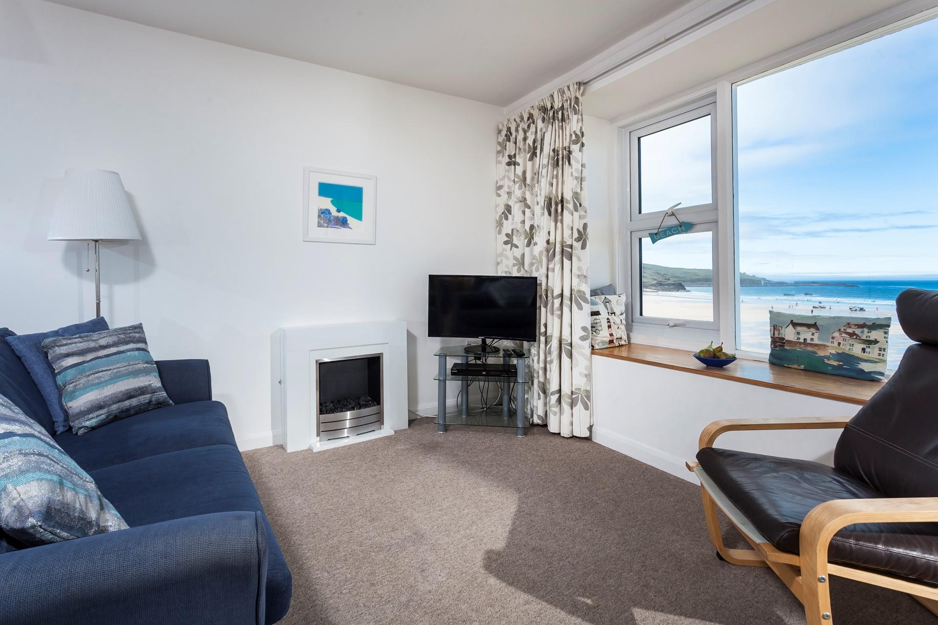 Watch the sun come down on the beach and wander back to your apartment to watch some TV.