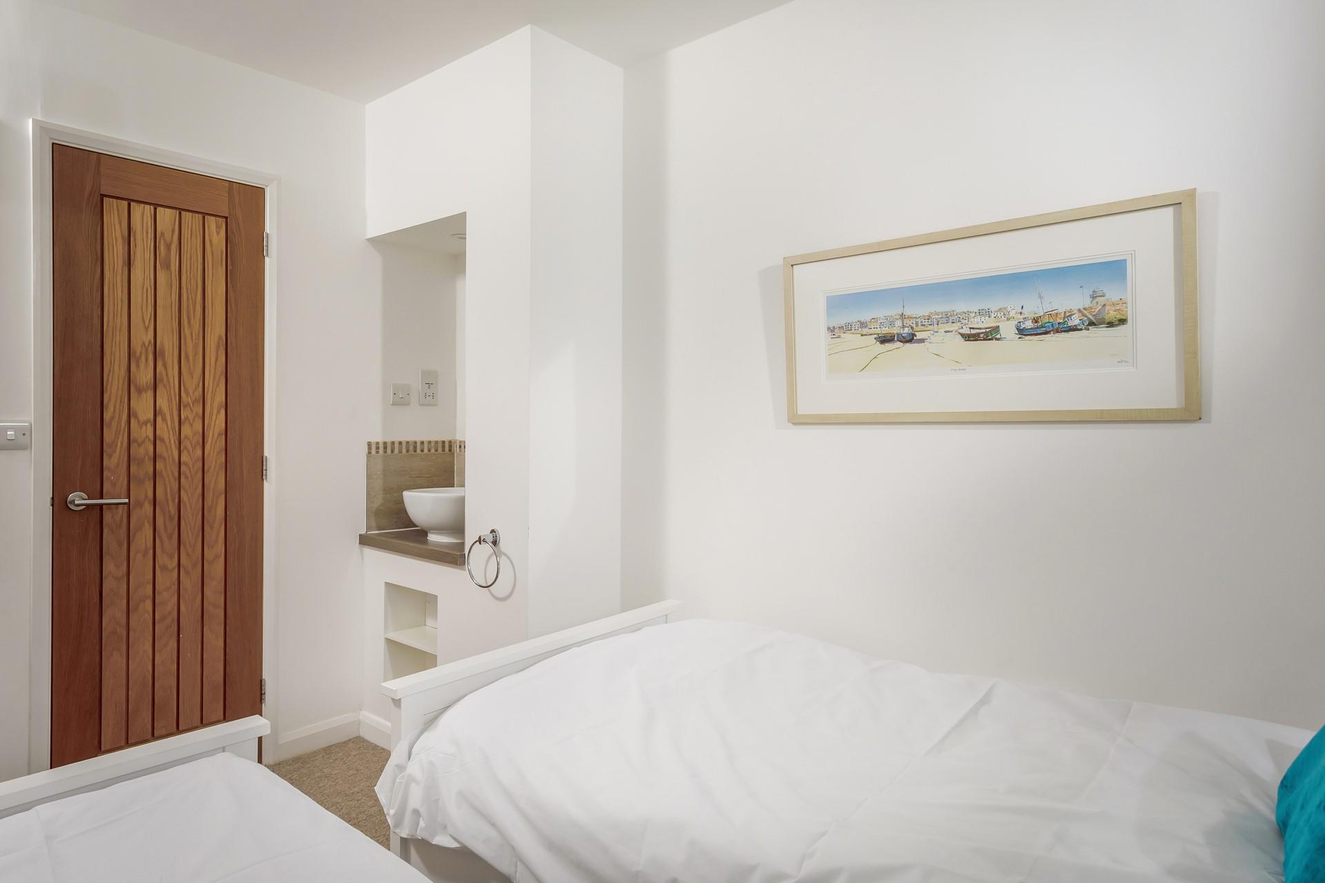 The cosy bedrooms provide the perfect space to relax after busy beach days.