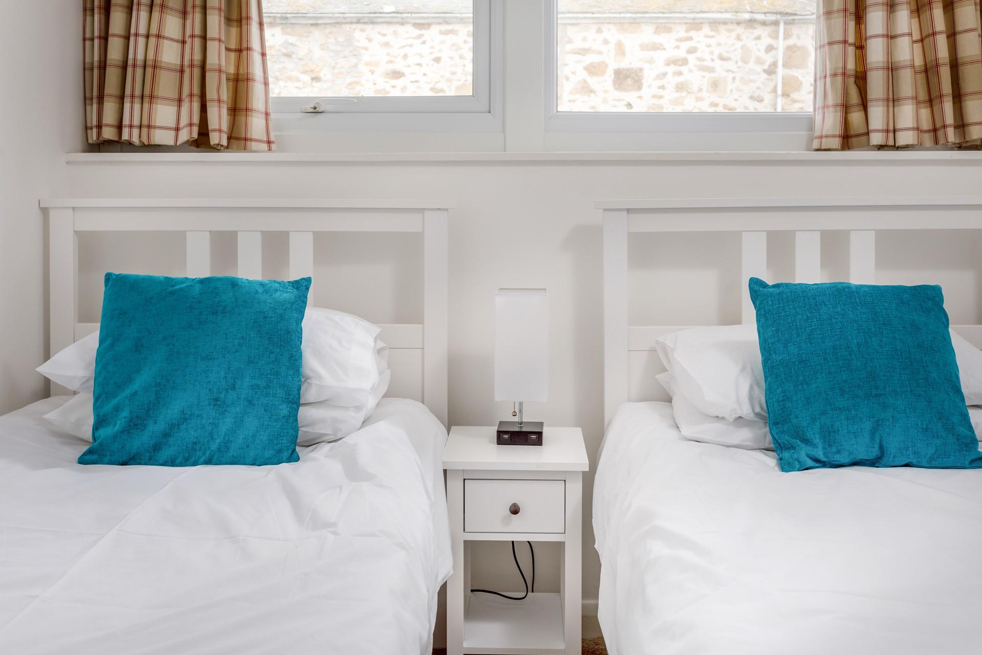 Bedroom 2 has twin beds and is perfect for children or adults.