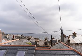 Stare out at the quirky rooftops of Mousehole and watch the sun setting over the ocean.
