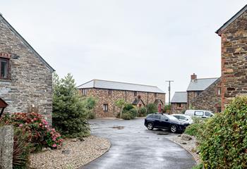 The approach to the courtyard of cottages tucked away down a lane but close to many amenities.