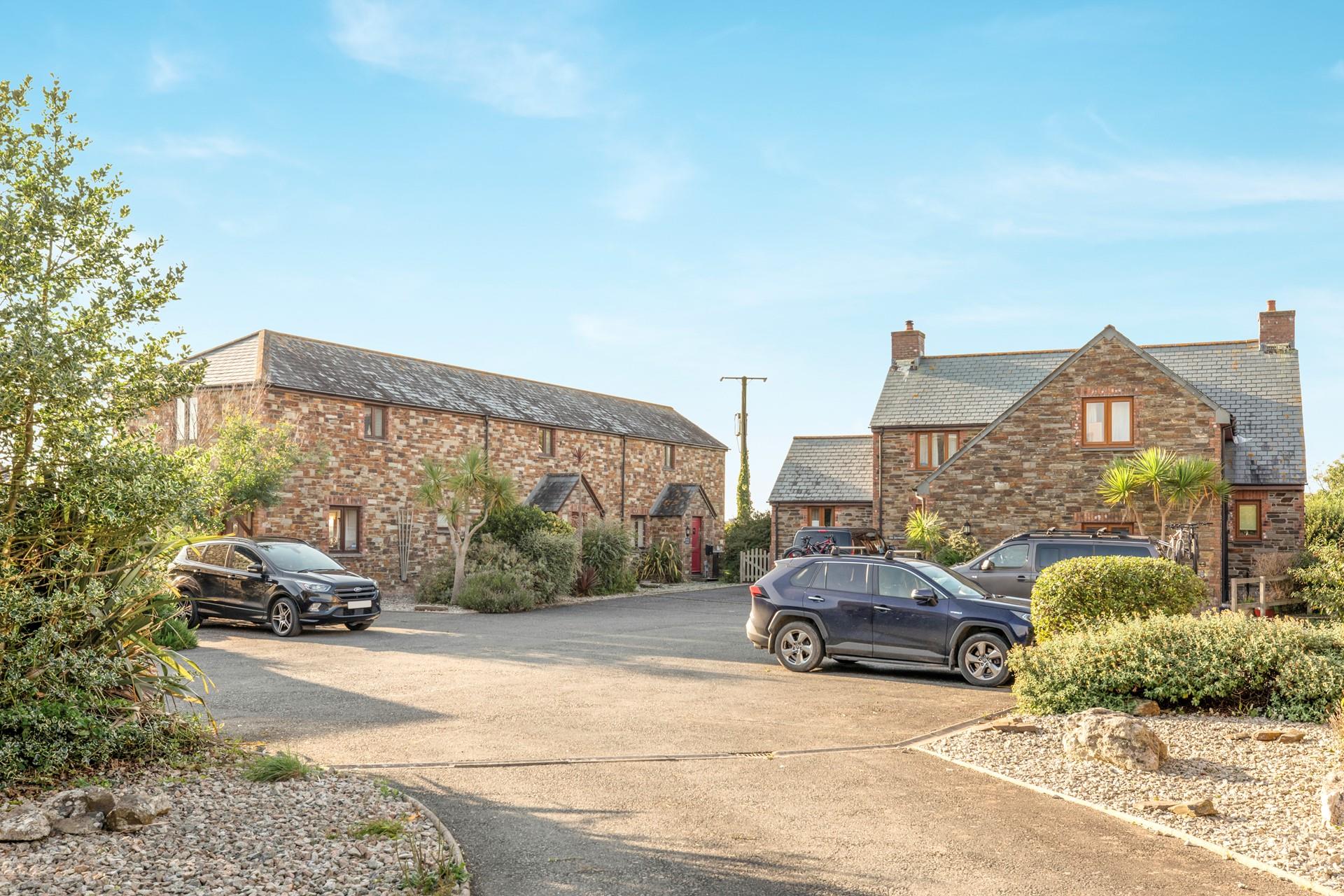 The approach to the courtyard of cottages tucked away down a lane but close to many amenities.