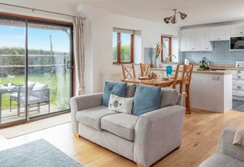 The light and airy living area looks out over the garden and has lovely countryside views.