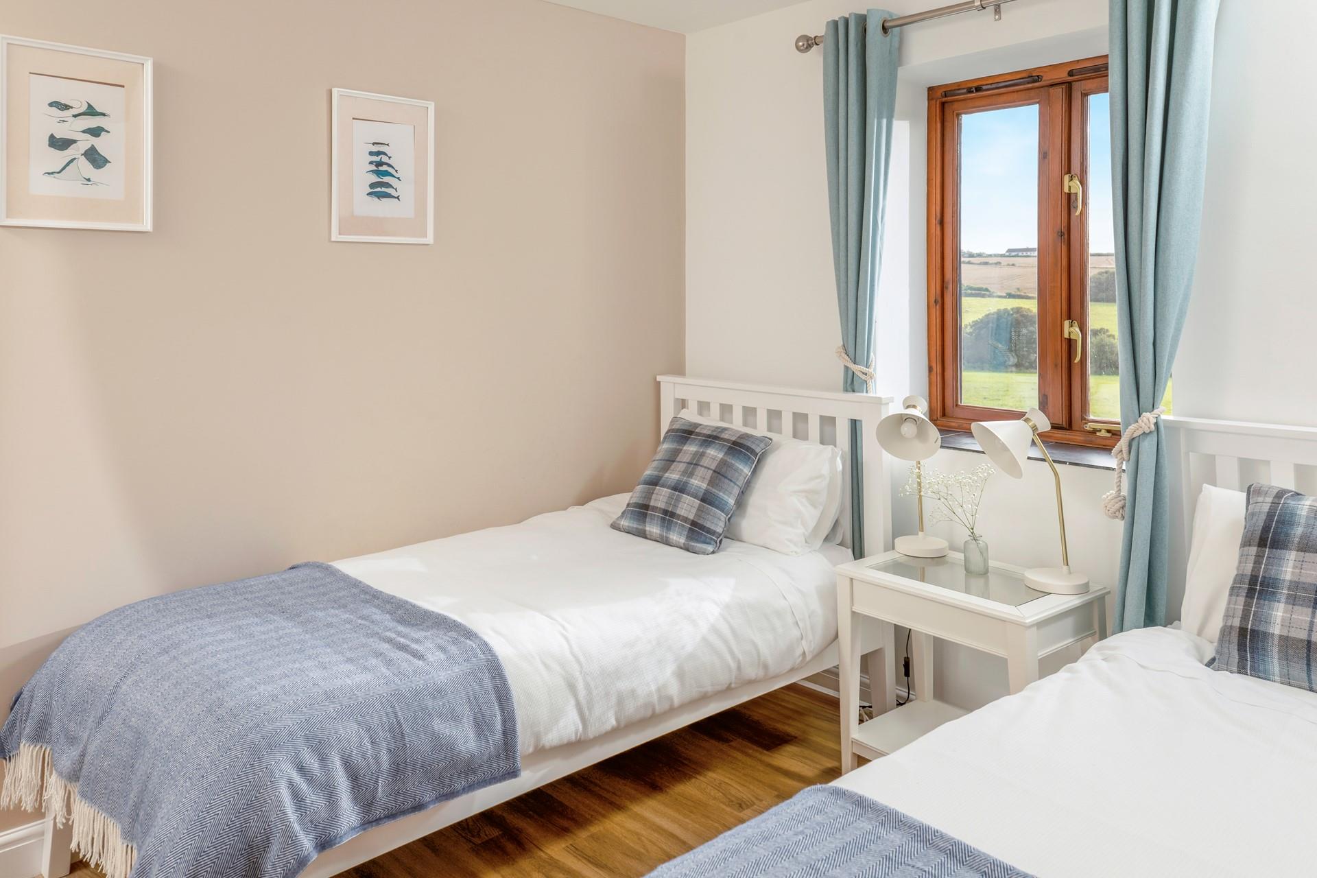 The twin room has lovely views across rolling fields.