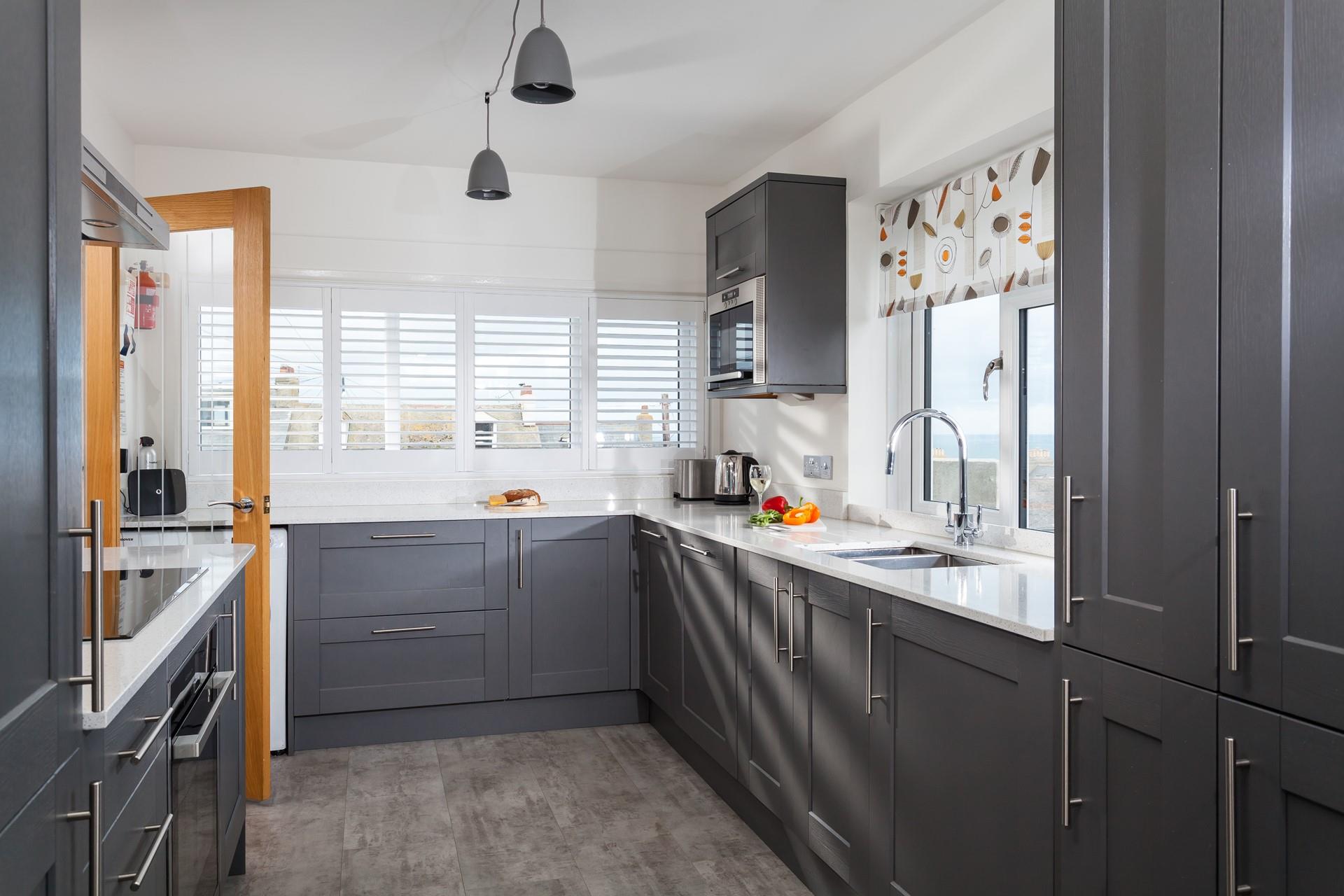 The modern kitchen is well-equipped for all your culinary needs.