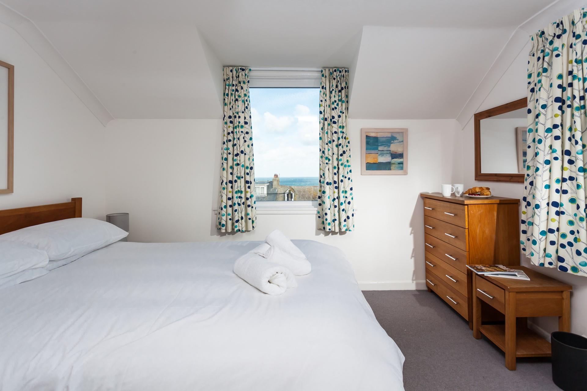 Sink into the soft white sheets and drift off to sleep.