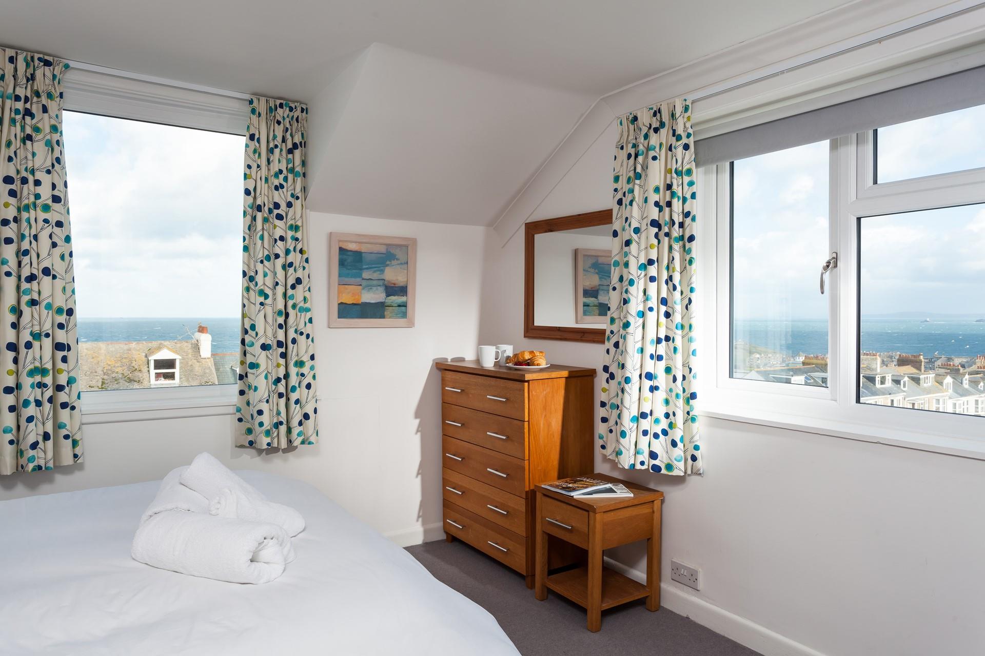 Wake up to a beautiful view of Godrevy Lighthouse and watch the world go by as you sip your morning cuppa.