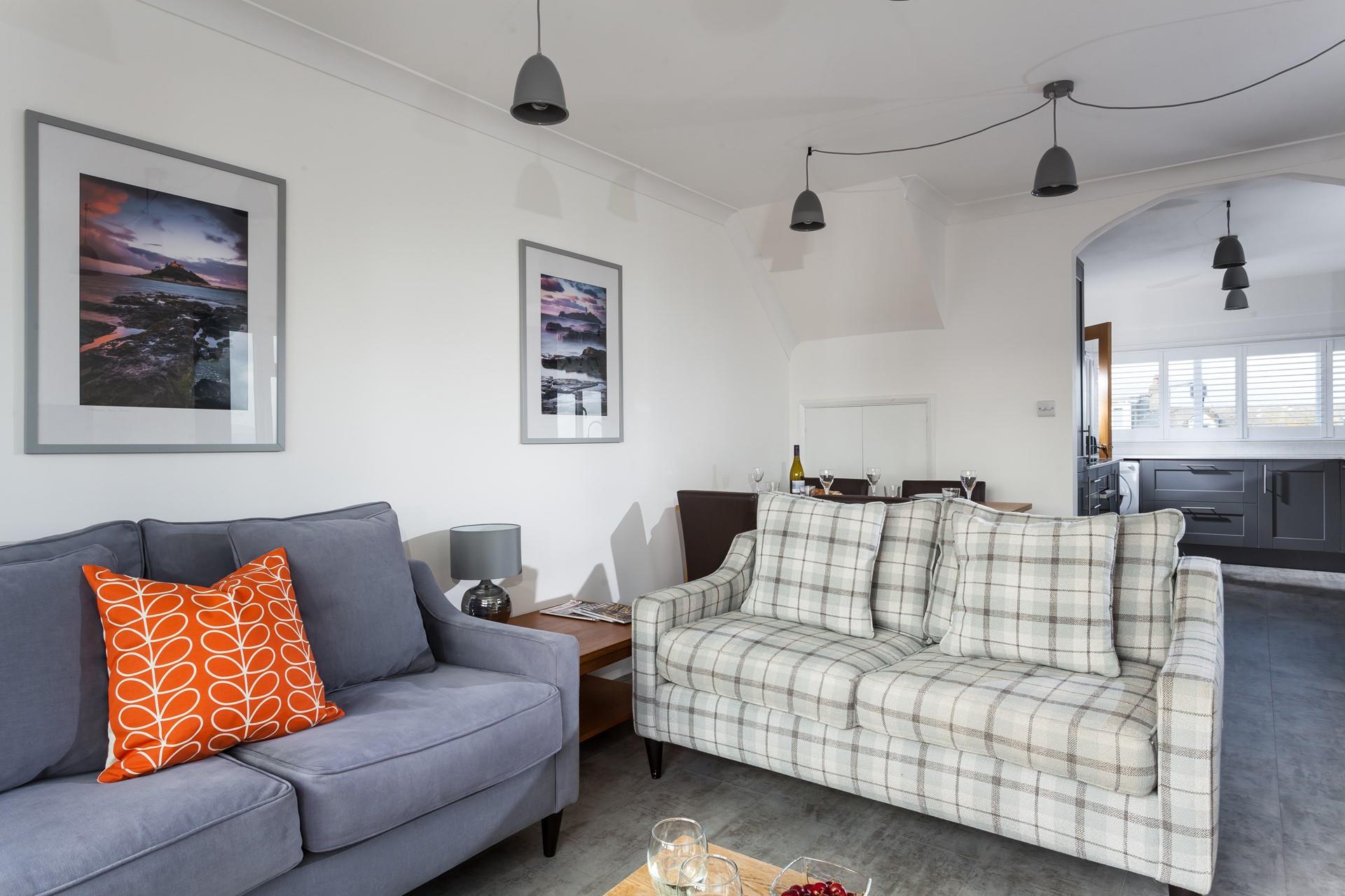The cosy living space provides a space for the whole family to relax together.