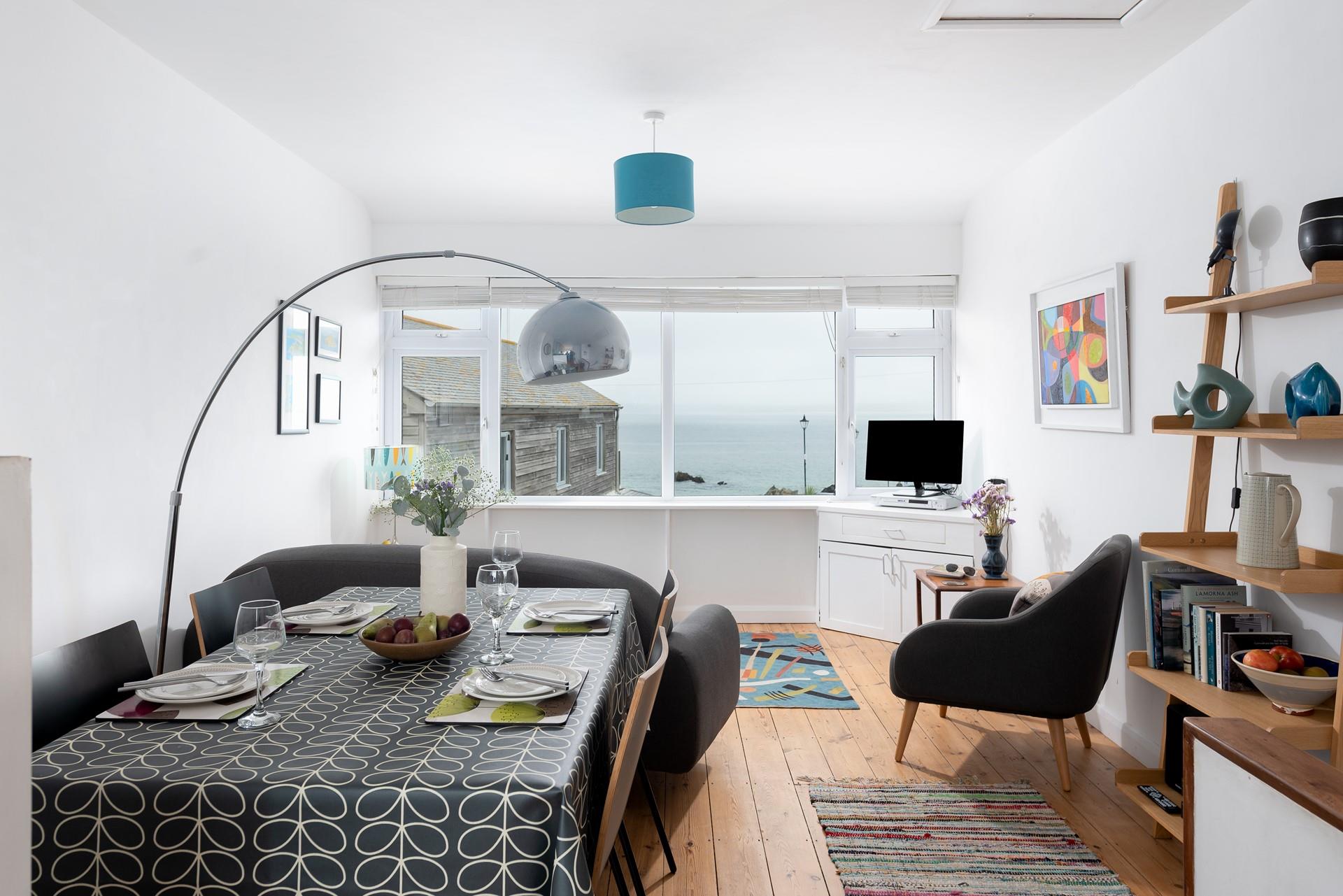 You can sit and watch the waves for hours in your cosy living area.