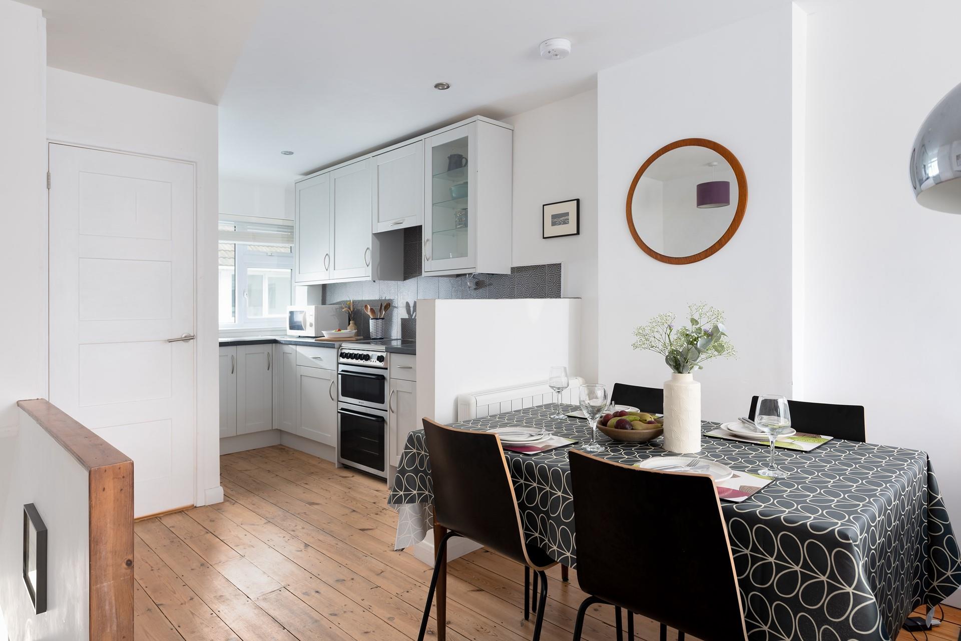 The dining table is the perfect place to eat your dinner whilst looking out at the stunning St Ives Bay.