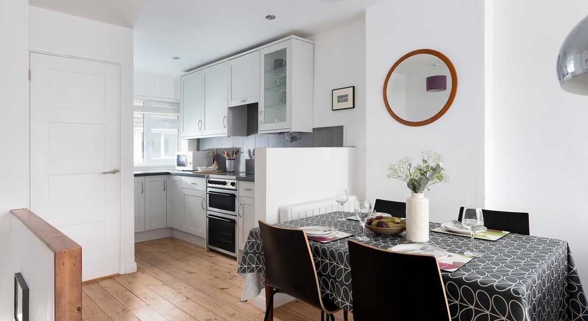 The dining table is the perfect place to eat your dinner whilst looking out at the stunning St Ives Bay.