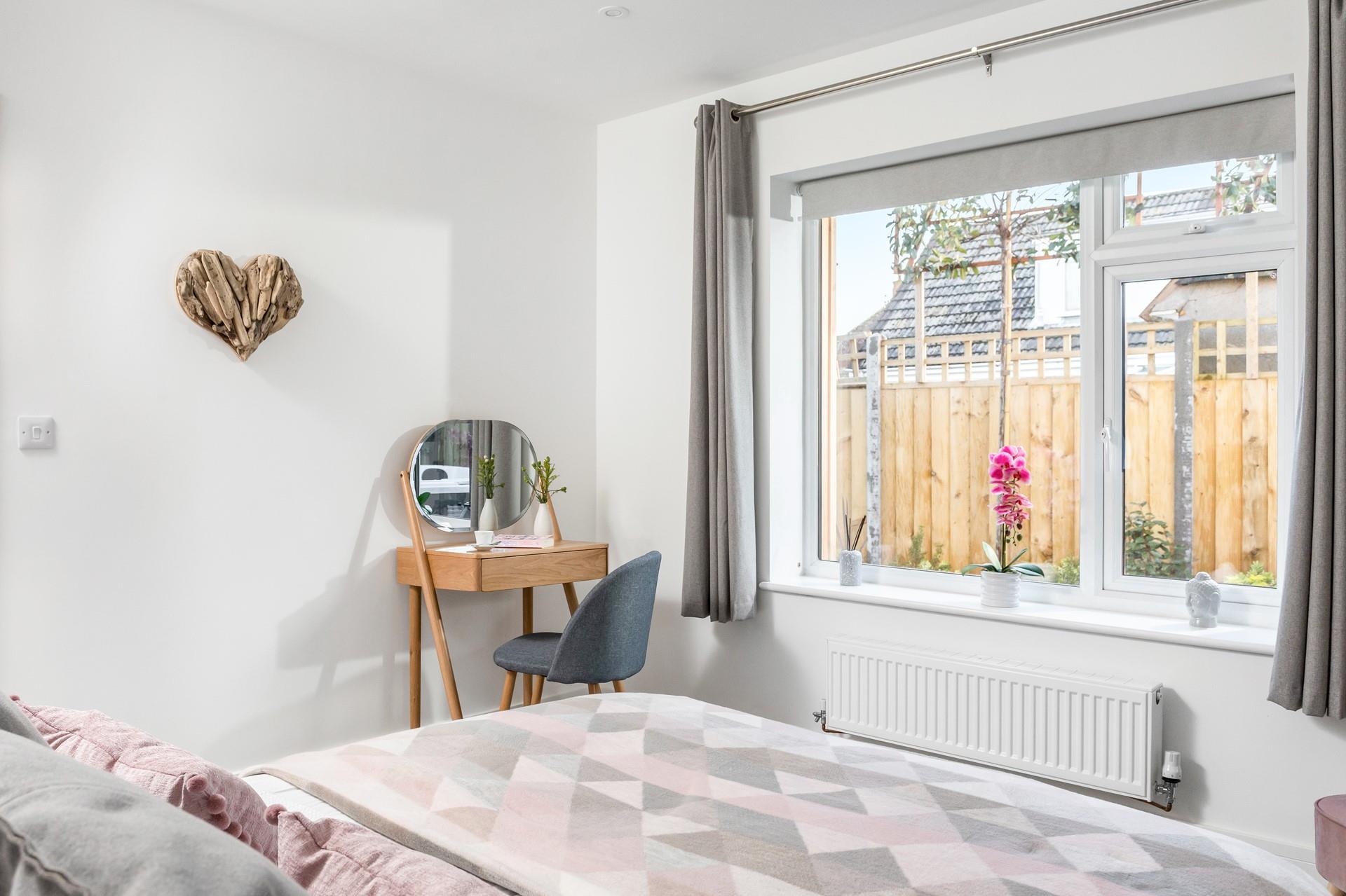 The main bedroom has a dressing table to get ready at each morning.