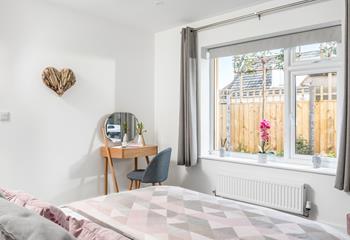 The main bedroom has a dressing table to get ready at each morning.