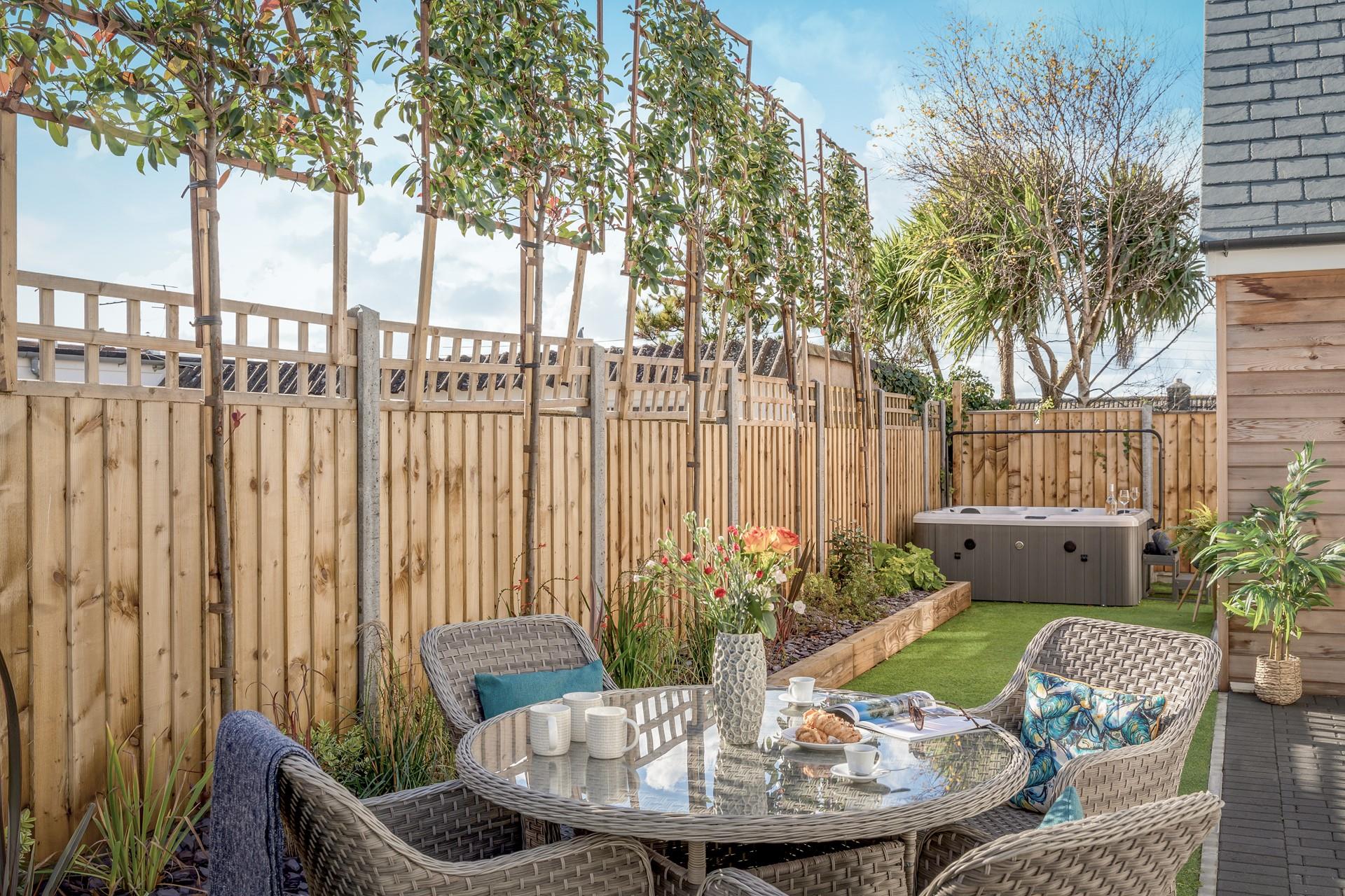 Enjoy alfresco dining before taking a dip in the bubbling hot tub.