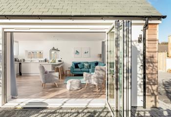 Open the bifold doors to let the fresh breeze run through on a warm day.