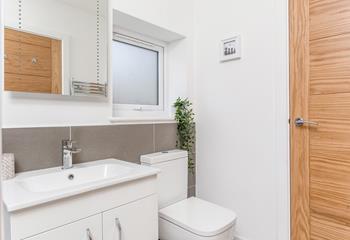 The washer/dryer is located in the shower room.