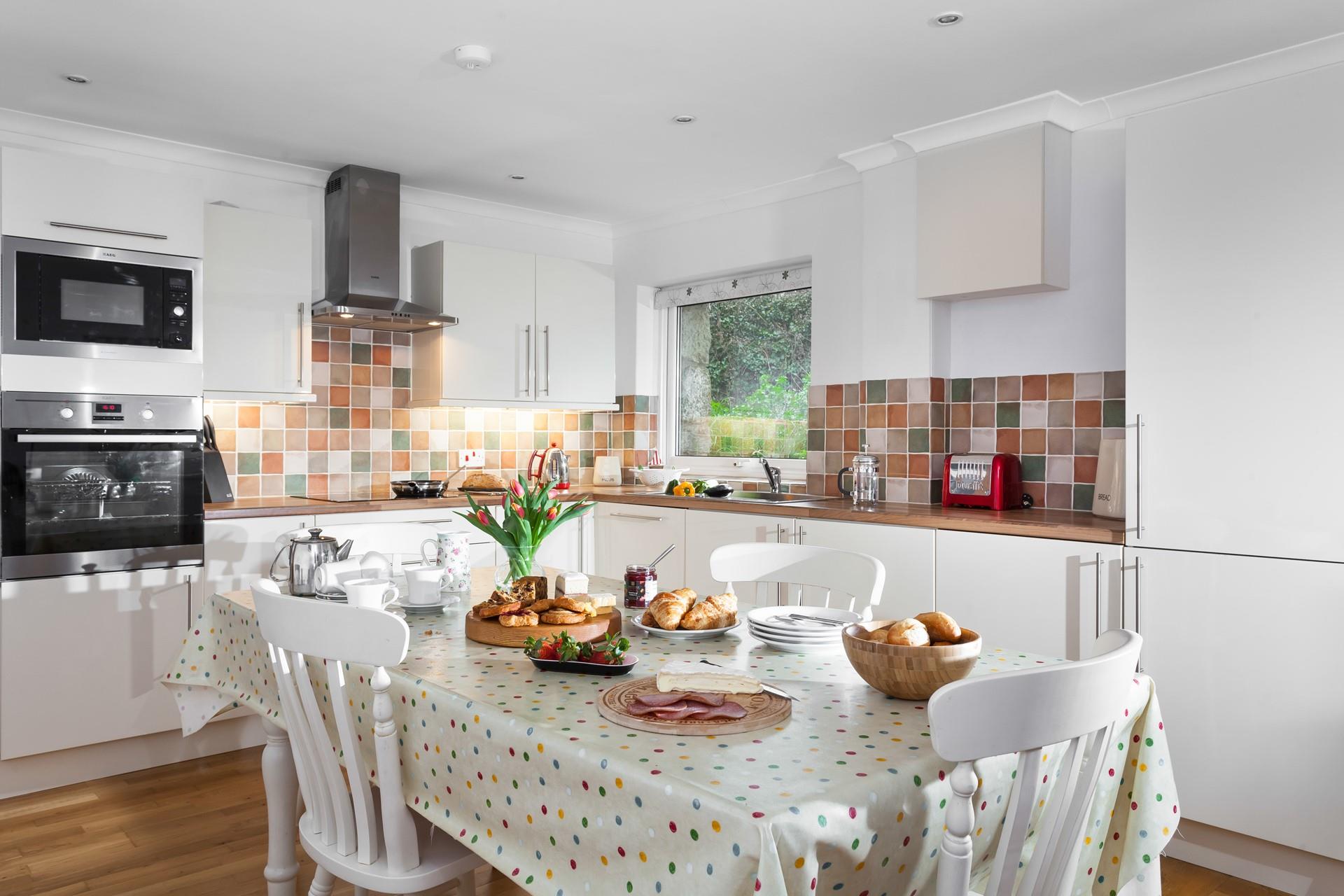 Gather around the dining table and enjoy a hearty meal after a day of walking the scenic coast path.