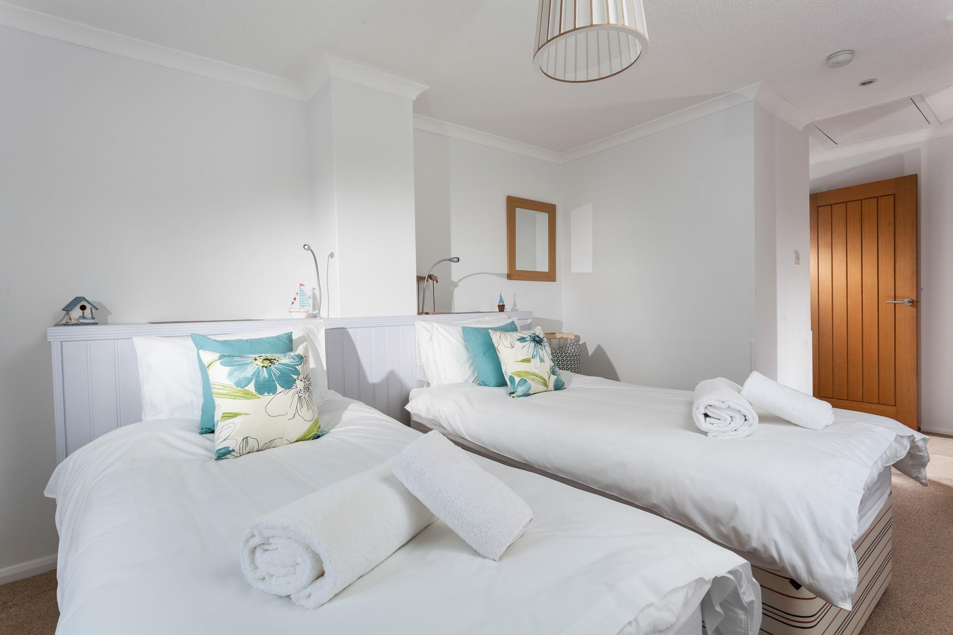 Crisp linen and fluffy towels await you at this cosy cottage.