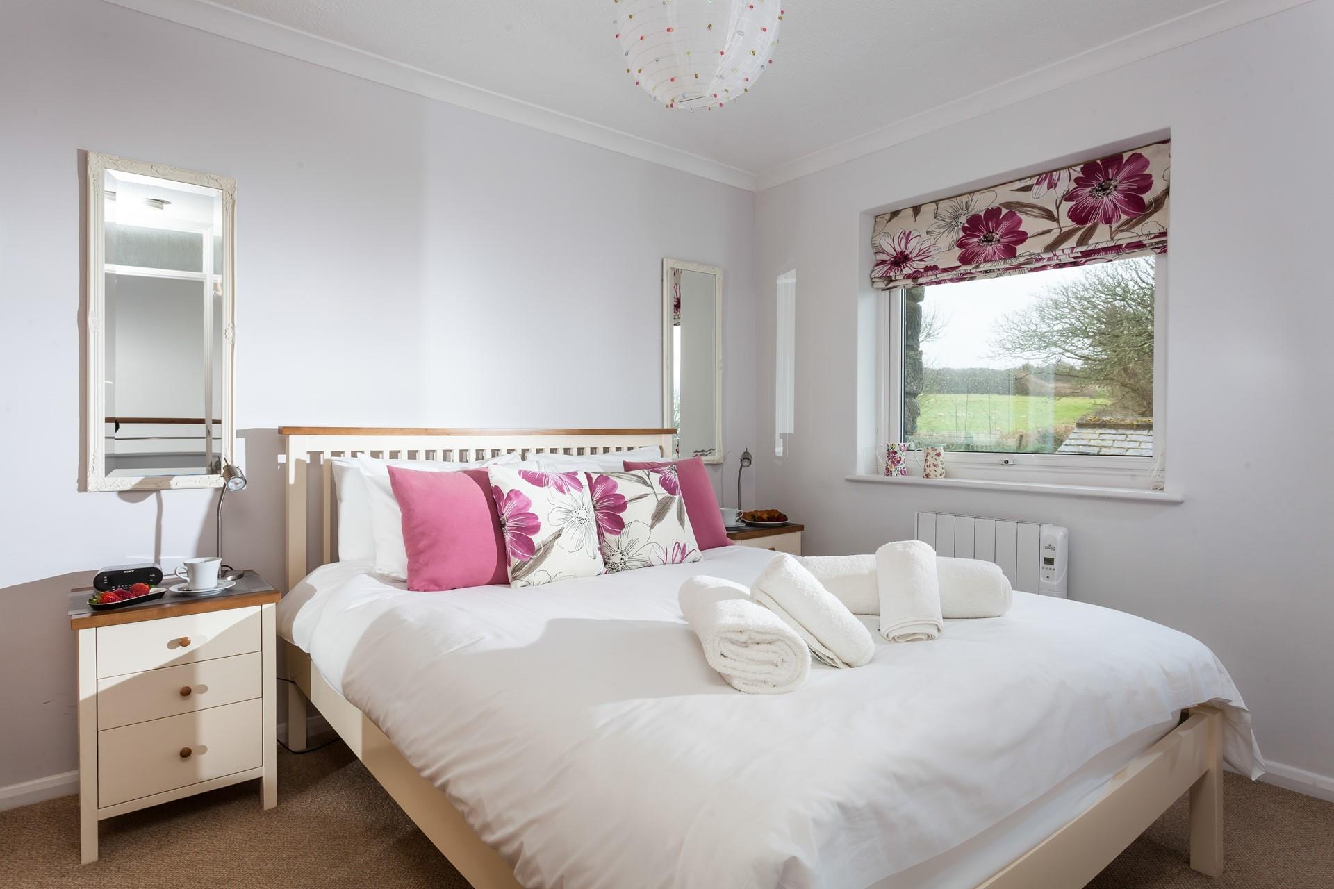 Sink into the soft sheets of the king size bed and drift off for a peaceful night's sleep.