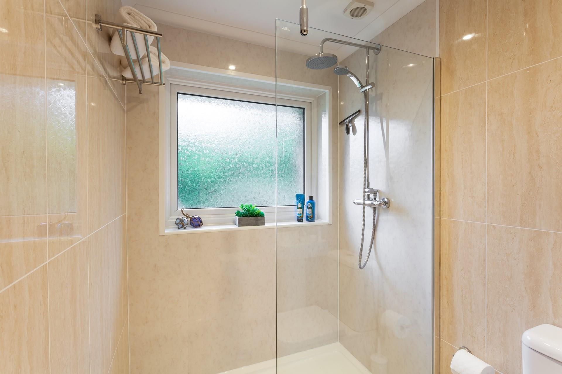 The bathroom is a modern and sleek space to get ready each morning.