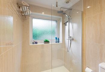 The bathroom is a modern and sleek space to get ready each morning.