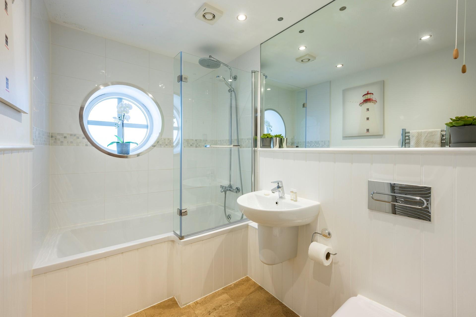 Enjoy a long hot soak in the bath after a day spent trying your hand at watersports such as paddleboarding.