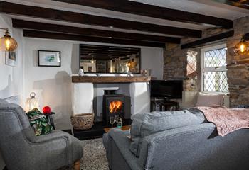 After a blustery beach walk, cosy up in front of the woodburner in your quaint cottage.