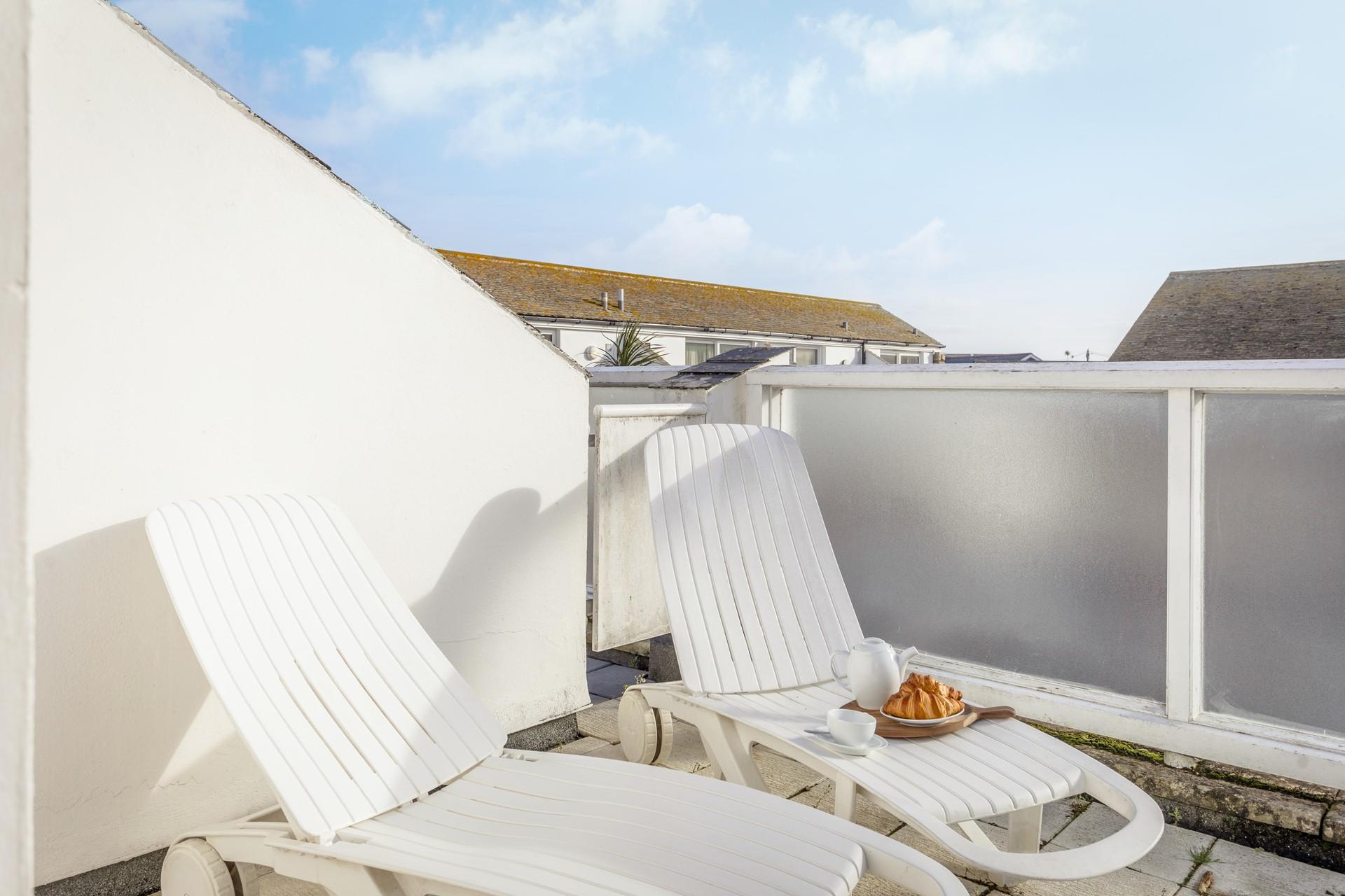 Put your feet up on the loungers which are perfect for sunbathing on a hot summer's day.