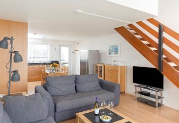 The spacious living area has plenty of room for all the family to unwind together.