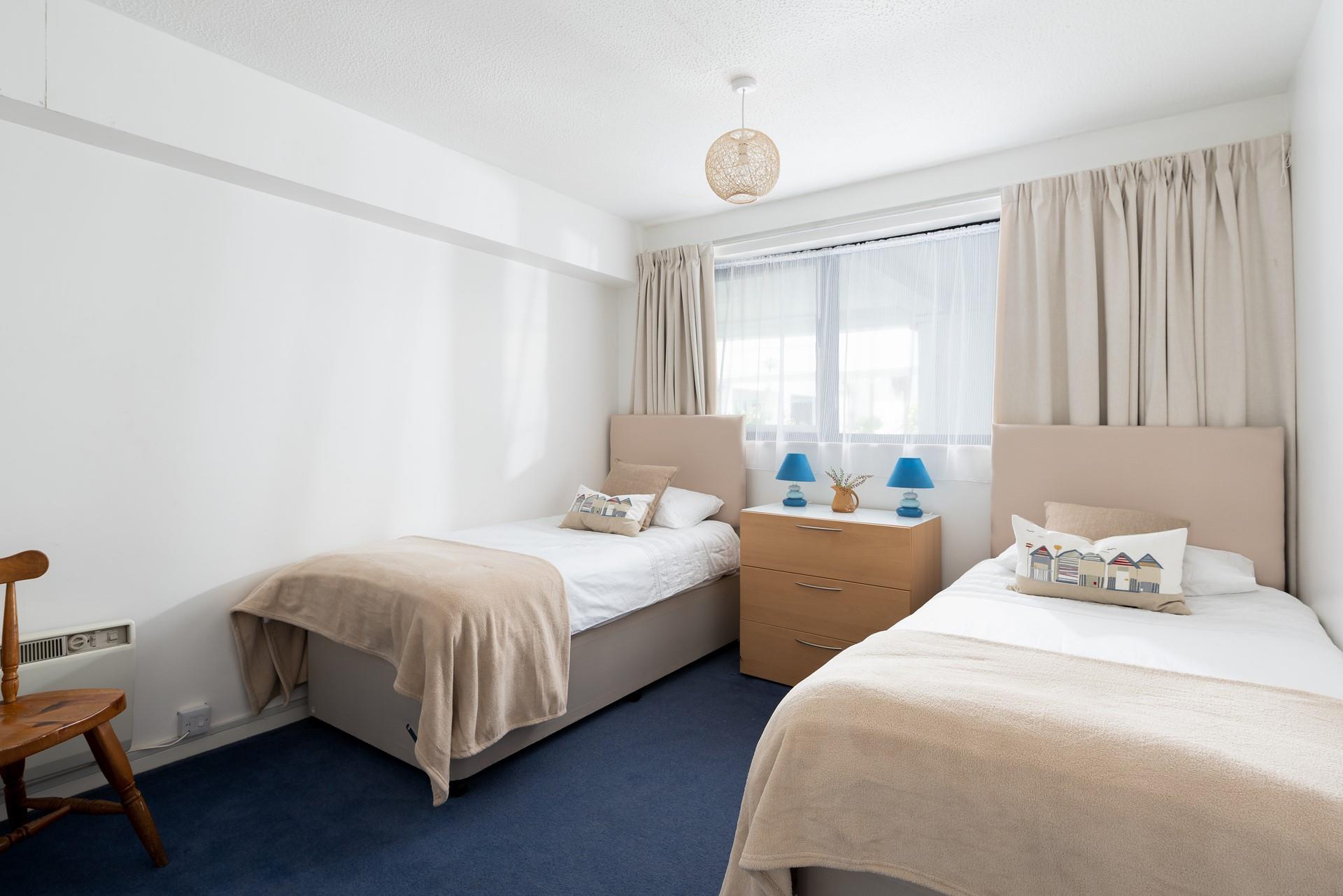 Bedroom 3 has twin beds perfect for kids or adults.