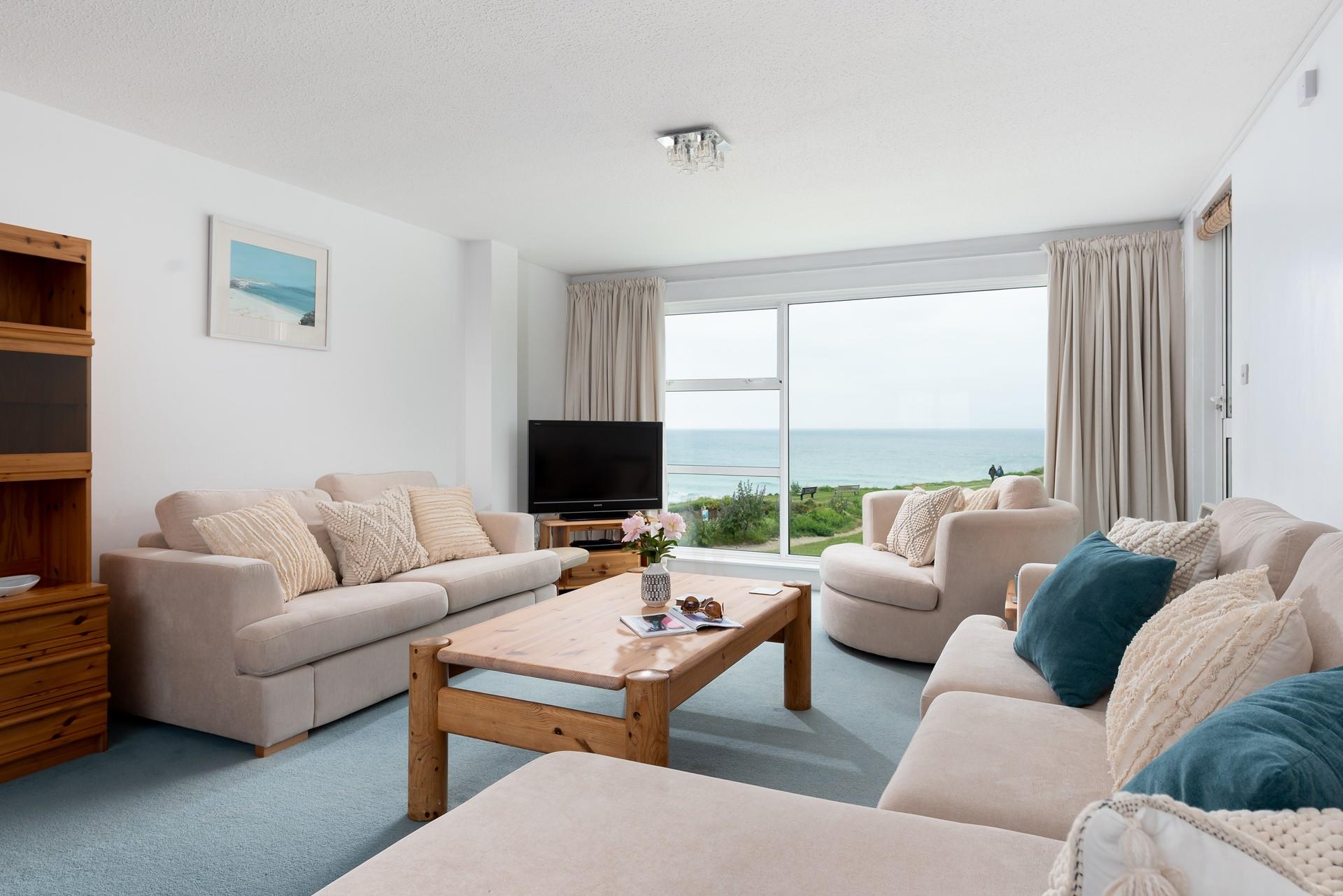The spacious sitting room offers guests a place to relax after a day on Porthmeor beach.