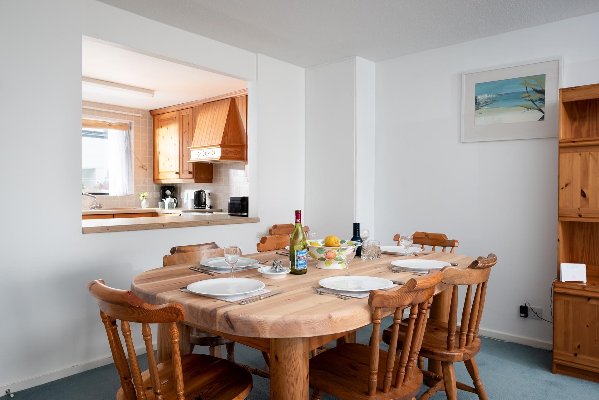 There is seating for everyone around the dining table.