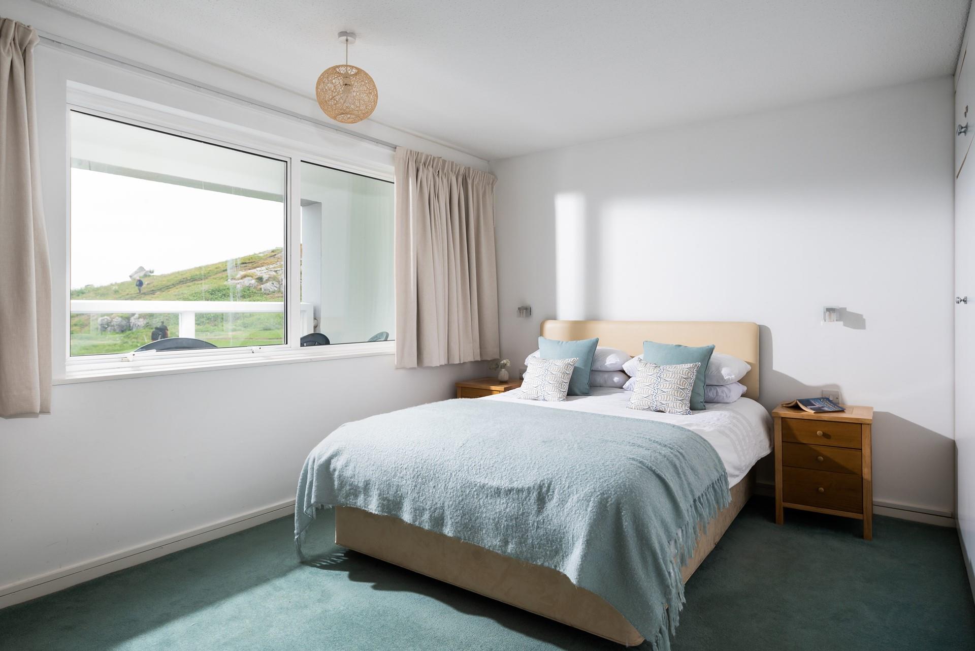 Wake up in the cosy king size bed to views of Porthmeor.