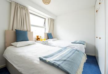 Bedroom 2 is comfortable with twin beds perfect for adults or children.