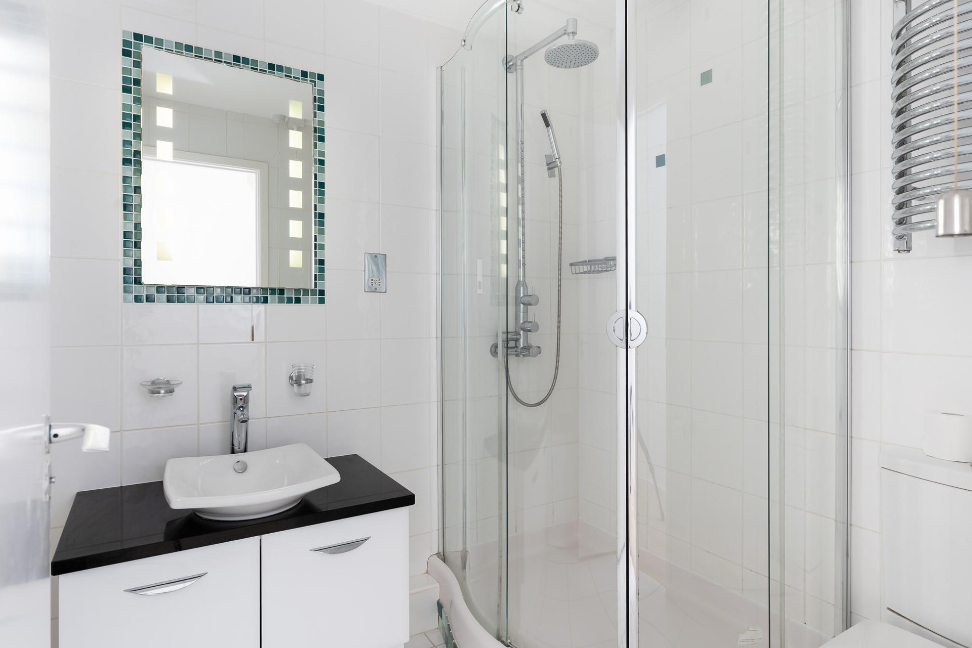 Wash off your sandy toes in the shower after a day on the beach.