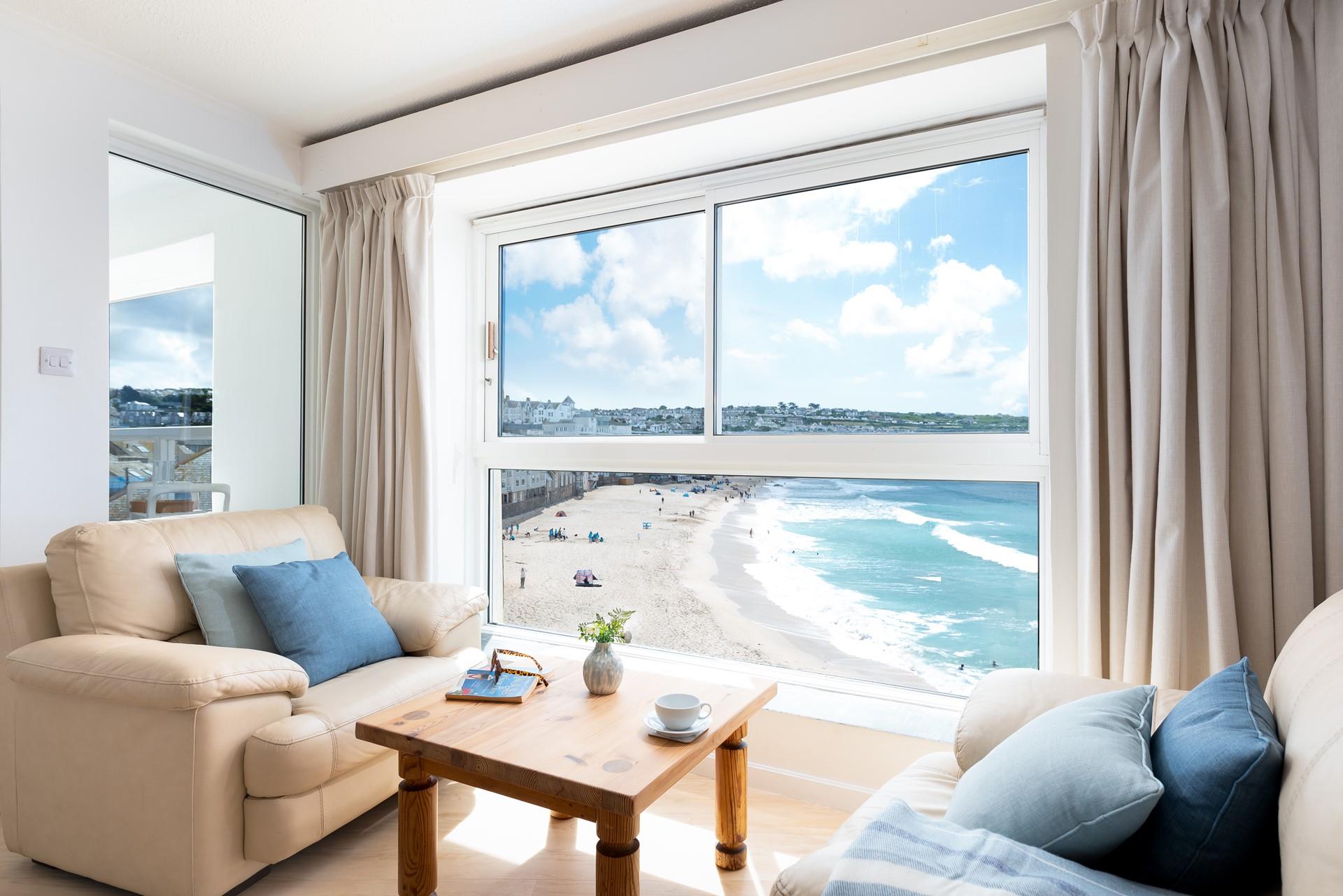 Sink into the sofa and watch the comings and goings on Porthmeor beach with a glass of something cold in hand.