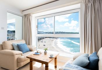 Sink into the sofa and watch the comings and goings on Porthmeor beach with a glass of something cold in hand.