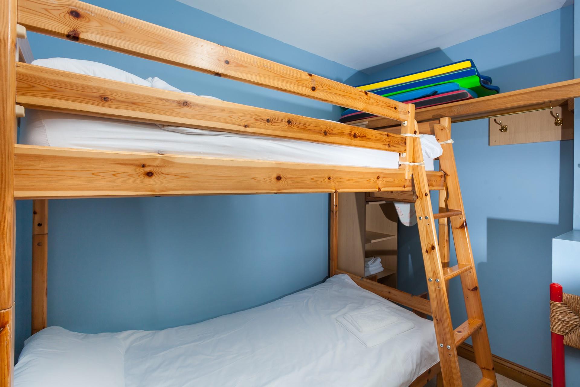 The bunk bedroom is a fun space for the kids to play and relax.