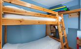 The bunk bedroom is a fun space for the kids to play and relax. - Thumbnail Image