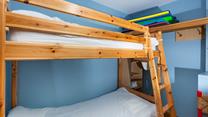 The bunk bedroom is a fun space for the kids to play and relax.