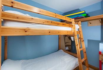 The bunk bedroom is a fun space for the kids to play and relax.