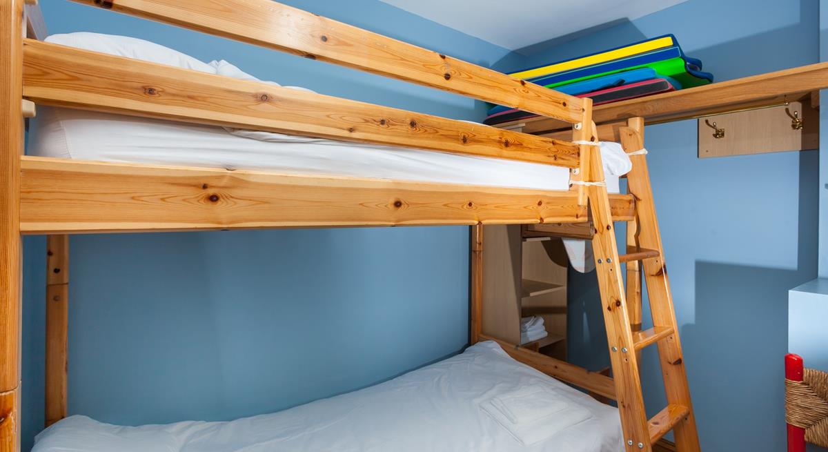 The bunk bedroom is a fun space for the kids to play and relax.